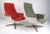 Matching pair of vintage fiberglass shell lounge chairs on swivel bases. Reminiscent of the classic Eames lounge, these...