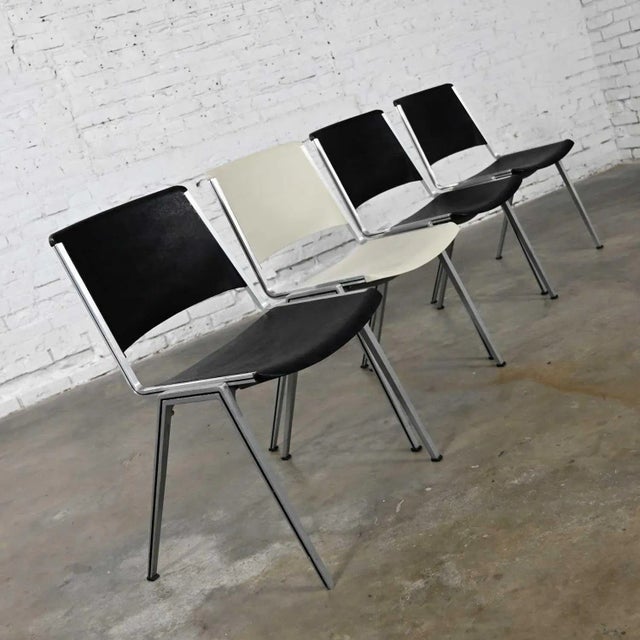 Gorgeous vintage Steelcase stacking chairs model #1278 1 white & 1 black set of 4. Great Mid-century modern industrial...