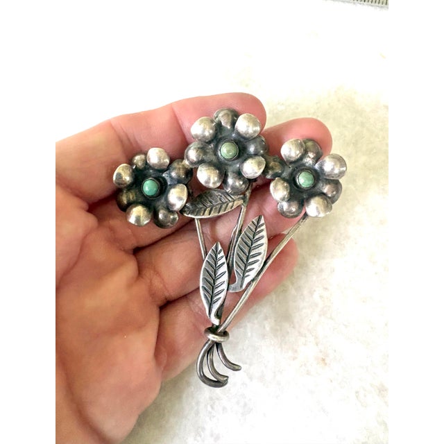 Stunning vintage sterling silver and turquoise floral brooch.
