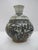 Antique Vietnamese jarlet possibly related to items found in the Hoi An Hoard shipwreck. The small jar or bottle features...