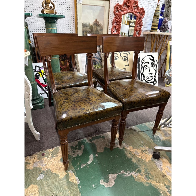 Fantastic set of 4 Neoclassical Wood Sculptural Klismos.Chairs. Each are comprised of solid wood with brass nail head...