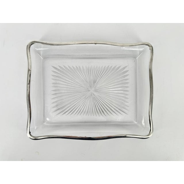 An elegant French XIXth century crystal tray with depth and round shapes, mounted with a silver strapping. This rare...