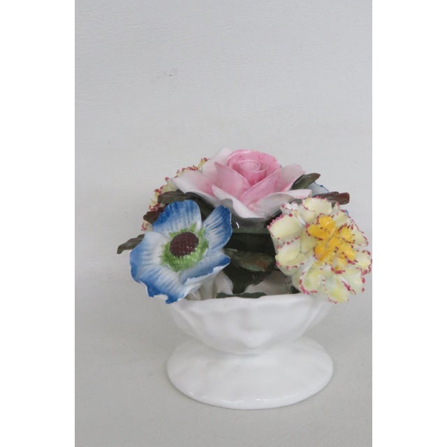 This gorgeous Floral Figurine is made of fine bone china. This darling collectible is marked on the bottom with the...