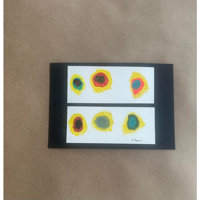 A bold and playful abstract composition featuring layered organic shapes in saturated hues. The repetition of form across...