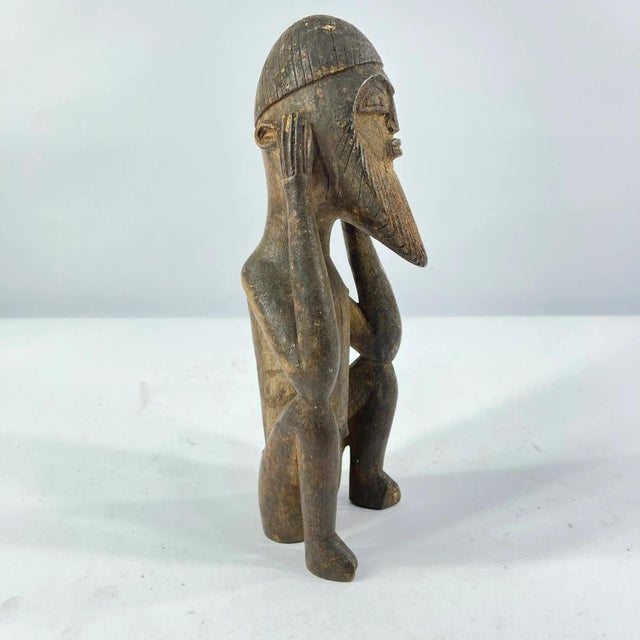 A wonderful artifact from Mali, the Dogon Sitting Figure, is crafted from a single piece of wood.Â Early history is...