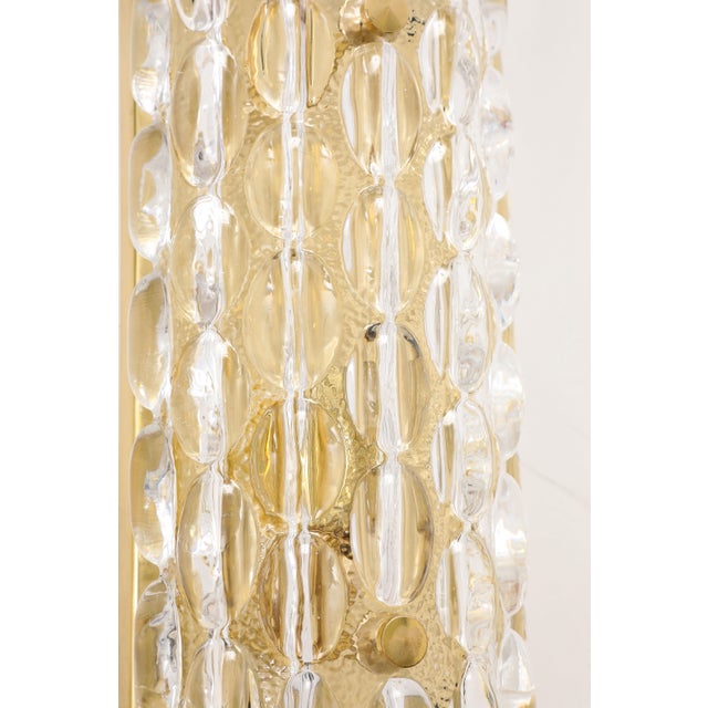 A wonderful pair of 1960's thick Crystal bubble sconces. The glass sits on a simple brass back plate with a single...