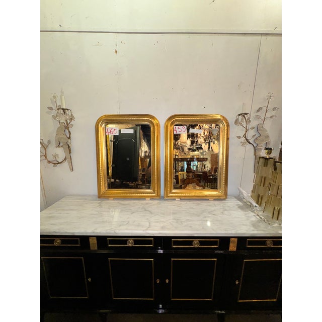 This product is a pair of French Louis Philippe giltwood mirrors, perfect for enhancing the look of any room. The mirrors...