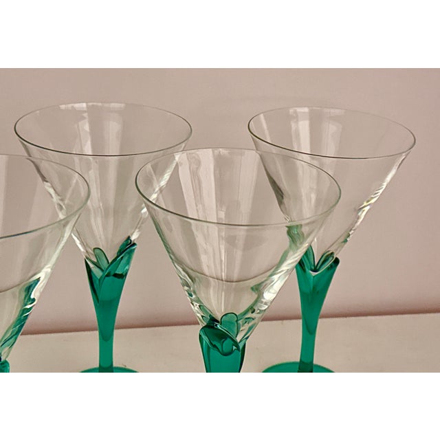 Six (6) beautiful crystal glasses by Italian designer Luigi Bormioli. The glasses feature a clear conical cup and a...