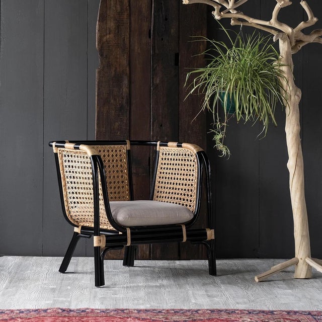 Crafted from black-toned bamboo framing and beige-colored rattan weave, the Quay Collection is French Colonial inspired...