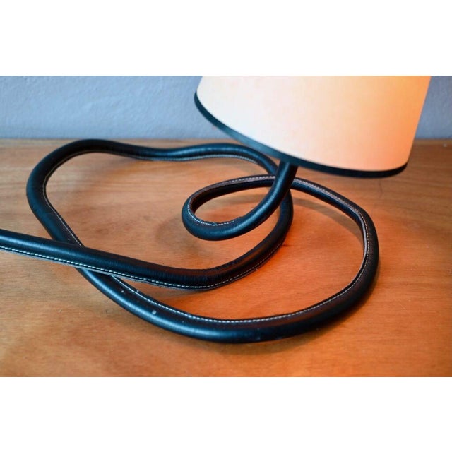 This 1980s lamp is wonderfully original! with its flexible cable encased in a faux leather sheath, the base becomes an...