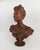 Sculpture in patinated terra cotta representing the bust of a young woman, hand-signed on the base by Max Blondat 1898....
