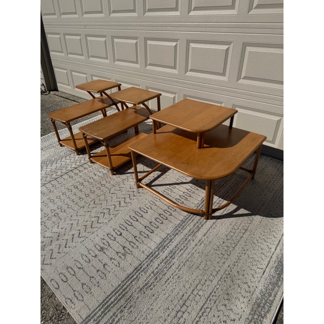 A beautiful three-piece Ashcraft table set. These multitiered accent tables have steam-bent solid wood. They are built...