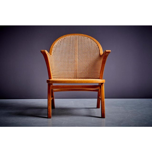 Stunning armchair with armrests, featuring Vienna straw caning, The chair has a frame made of lacquered cherrywood and a...