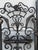 An exceptional pair of antique wrought iron architectural gates reportedly salvaged from the historic Bullocks Wilshire...