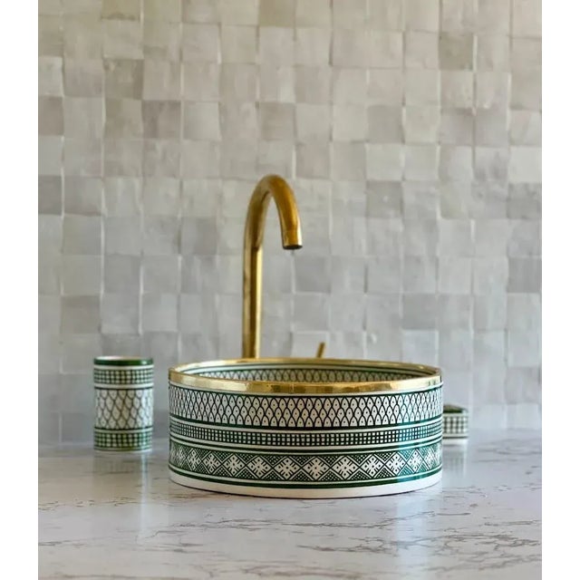 Our Ceramic Sink is stunning addition to elevate your bathroom decor. Handcrafted with meticulous attention to detail,...