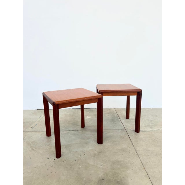 Square teak side table from the 1970s, Danish Scandinavian design. Solid teak frame and legs, warm-toned teak veneer top....