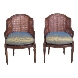 Theodore Alexander Cane Back Carved Mahogany Arm Chairs- A Pair For Sale