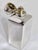 An Edwardian sterling silver and gilt scent bottle by Alfred Clark, hallmarked London 1904. Of plain rectangular form, the...