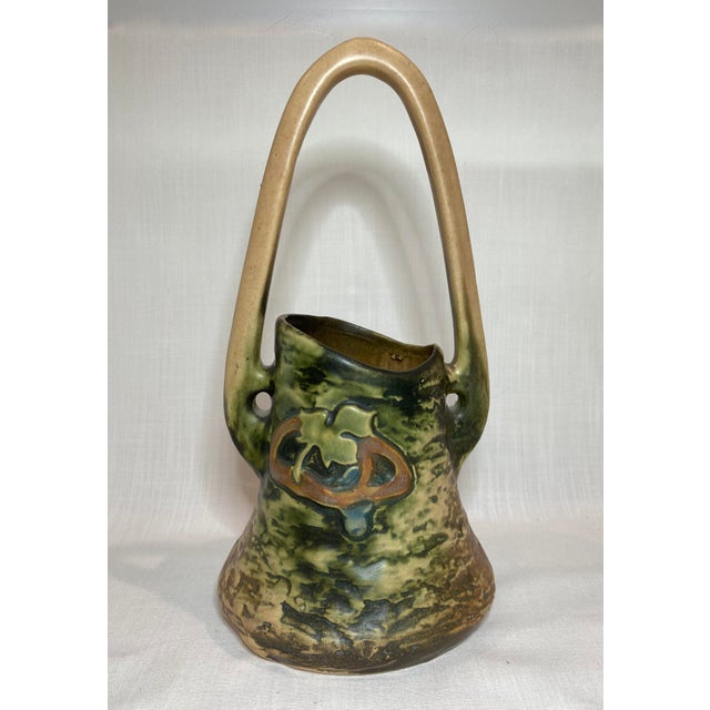 A fabulous antique Roseville Pottery basket vase from the Imperial I or Imperial Textured line which was introduced in...