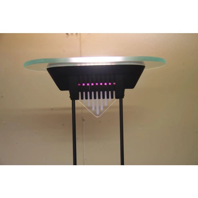 1980's designed floor lamp from Artup Co. This halogen light has a dimmer switch and there is a great purple glow on the...