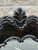 Gorgeous oversized wall mirror featuring sweeping scrolls, leafy foliate motifs, and a prominent crest at the top. Its...