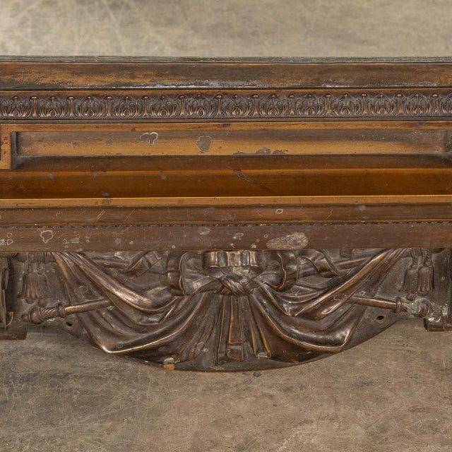 Antique late-19th century large bronze framed mirror with a cast monogramed crest entwining the initials r c i of the...