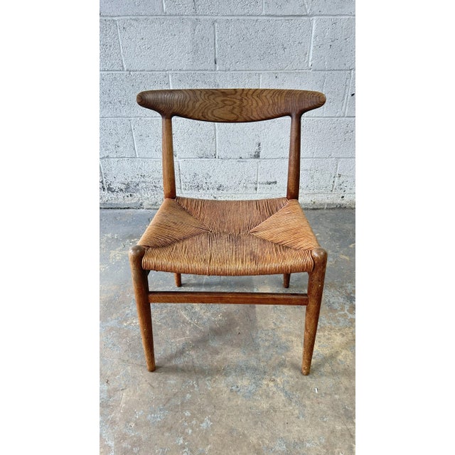 An incredibly rare set of 6 Original 1950's Hans Wegner C.M. Madsens "W2" Teak and Oak Rattan Seat Chairs. Each chair...