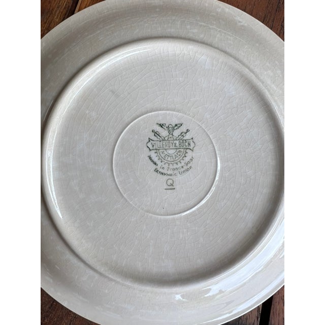 Beautiful set of 4 Villeroy & Boch plates, made of glazed ceramic, in an elegant powder pink tone with a thin black border...