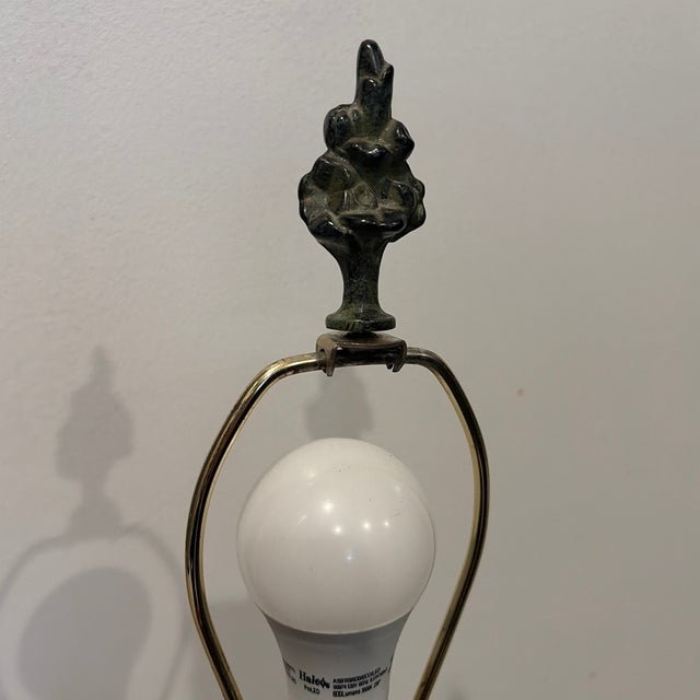Textured green verdigris patina on this lamp in an elegant conical jug shape.