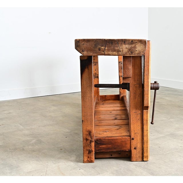A French 19th century artisan’s workbench from circa 1880, made of thick beech planks for durability that continues over a...