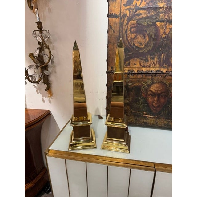 Pair of French Brass Obelisks. These pieces sit at the intersection of neoclassical French décor, 1970s Parisian glam, and...