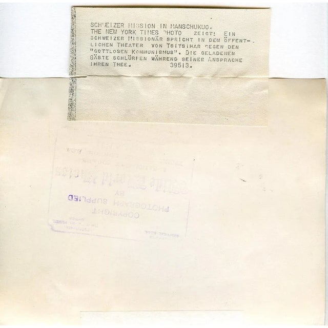 This Conference at the theater of Qiqihar is a b/w photographic print on polished paper, taken on May 13, 1939 by Wide...