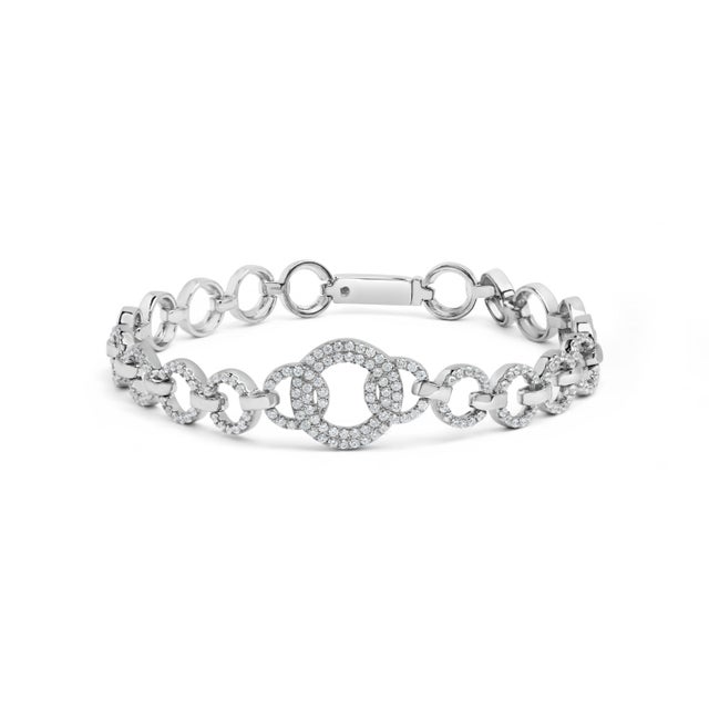 Encircle your wrist with the exquisite elegance of the .925 Sterling Silver Circle Link Bracelet, a spectacle of...