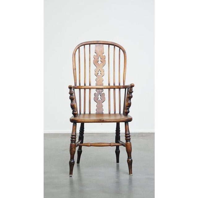 This very beautiful, practical antique English highback Windsor dining room chair with elegant details. This beautiful...