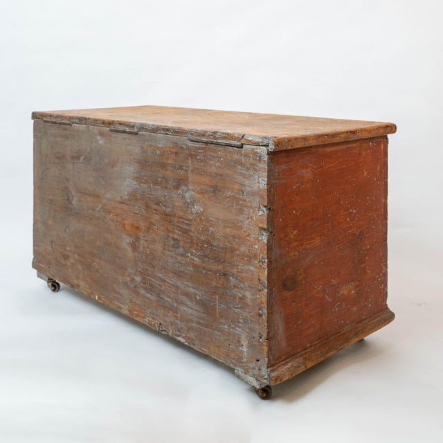 This rustic antique blanket chest dates to the late 1800s and features its original, beautifully weathered paint in a...