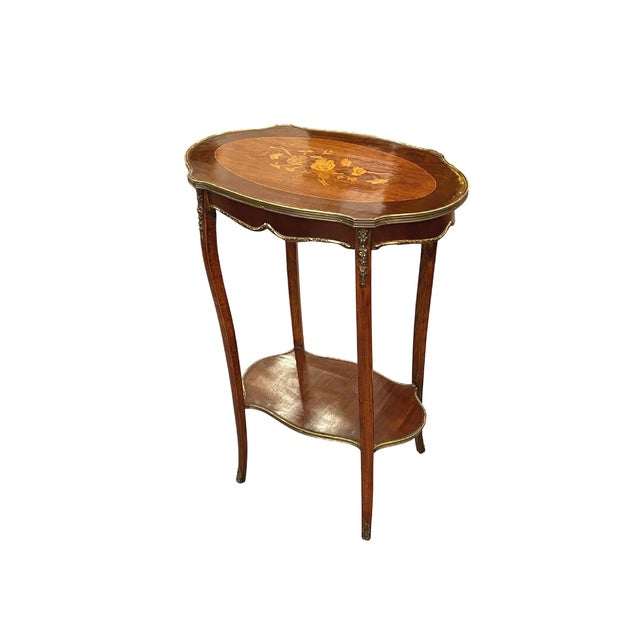 Its beech wood structure is finely covered by mahogany veneers on the sides and marquetry on the cherry, lemongrass and...