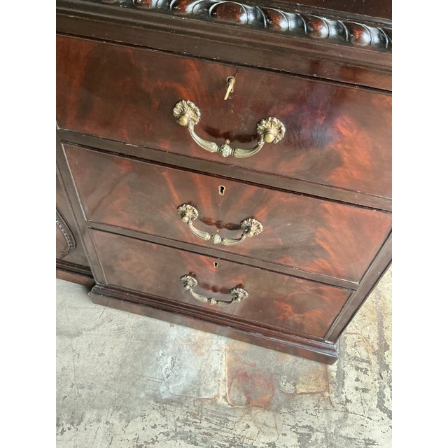 Elevate your dining room or library with this commanding Vintage Regency style breakfront. Expertly crafted in the manner...