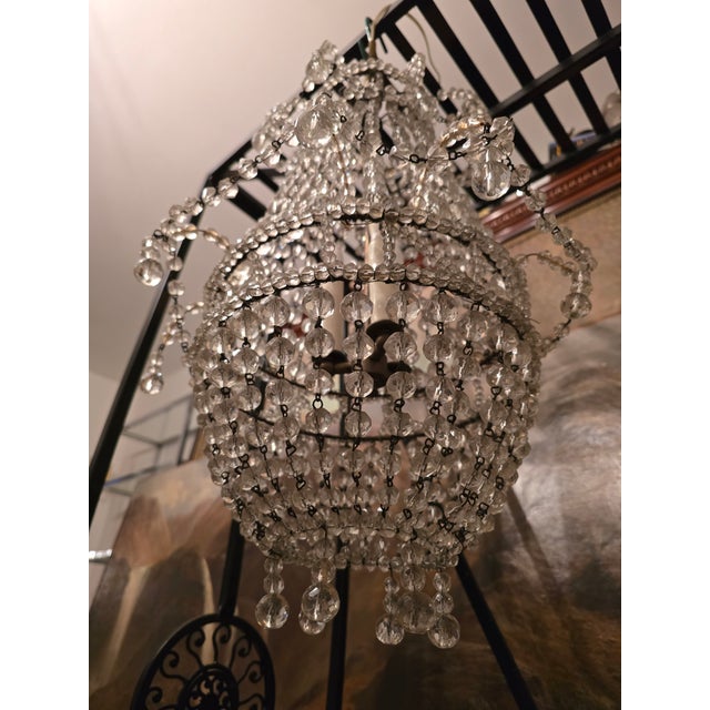 A vintage gem of a chandelier attributed to Bagues maison from the early mid century modern era. Having a very desirable...