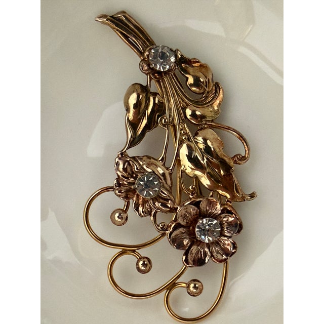 Vintage Gold-tone Sterling Silver Flower Bouquet Brooch The centers of the three dominant blossom heads are inset with...