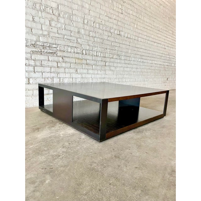 Stunning coffee table from legendary designer Christian Liaigre (1943-2020) Square with oak top and bottom finished with a...
