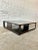 Stunning coffee table from legendary designer Christian Liaigre (1943-2020) Square with oak top and bottom finished with a...