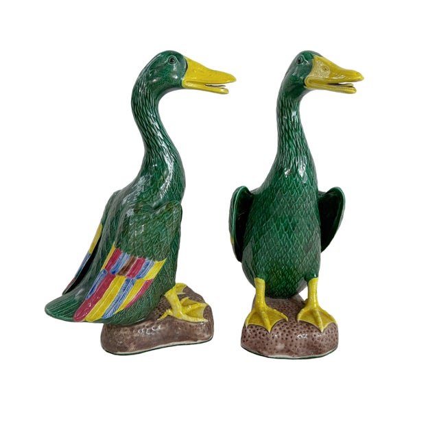 This is a 1950"a pair of Chinese export ceramic mallard ducks featuring finely molded feather texture and vibrant hand-...
