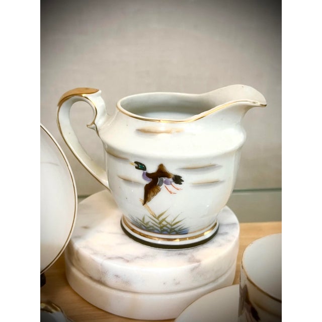 Late 19th Century Antique Hand-Painted Ducks in Flight Teacup and Saucer Sets with Creamer & Sugar- 10 Pieces For Sale - Image 5 of 7