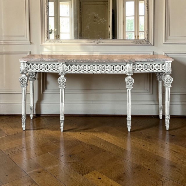 Grand and airy in presence, this beautifully carved Italian console reflects the enduring elegance of the Louis XVI style,...