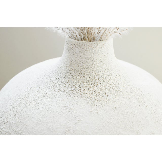 Stylish organic earthenware vase with large 13" globe shape body. We love it's pretty soft natural crackle finish! WE...