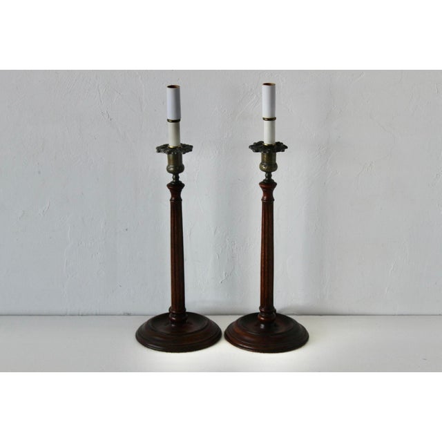 Georgian-style mahogany candlestick table lamps, featuring a slender, turned mahogany stem and a delicate cast brass...