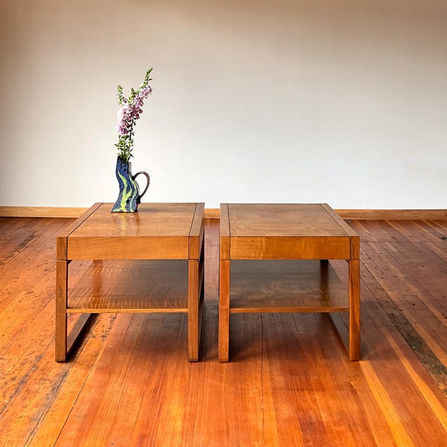Timeless pair of mid century teak side table made by Founders. Both feature a hidden drawer. Some light discoloration as...