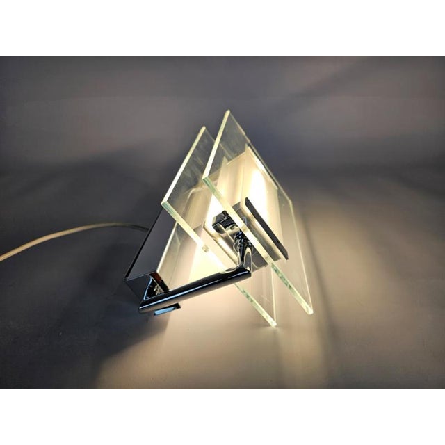 Leucos trecentosessantagradi is a diffused light wall/ceiling lamp with adjustable diffuser. metal frame, glossy chrome....