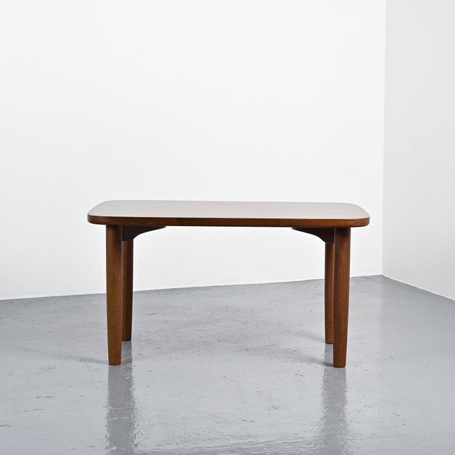 Dining table model T-2671 designed by Sori Yanagi in 1972 and produced by Tendo in Japan. The rectangular tabletop with...