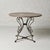 A breathtaking 19th century Belgian round table, pairing a magnificent original circular marble top with an elegantly...